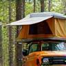 Client Ana Vargas setting up rooftop tent on finished rig